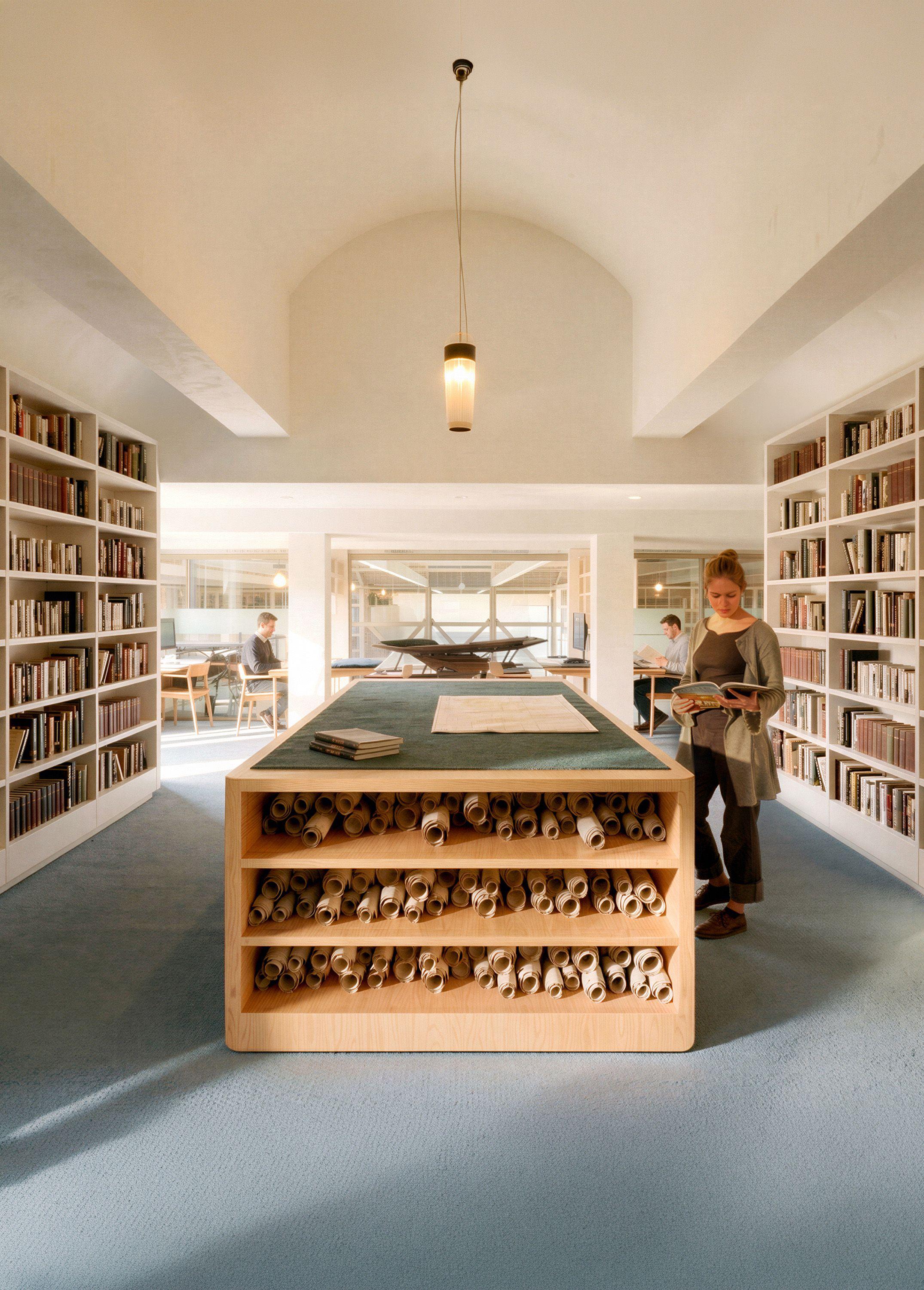 The library at the Archive, Library and Research Centre, RAF Museum, London, rolled charts stored in the central oak table
