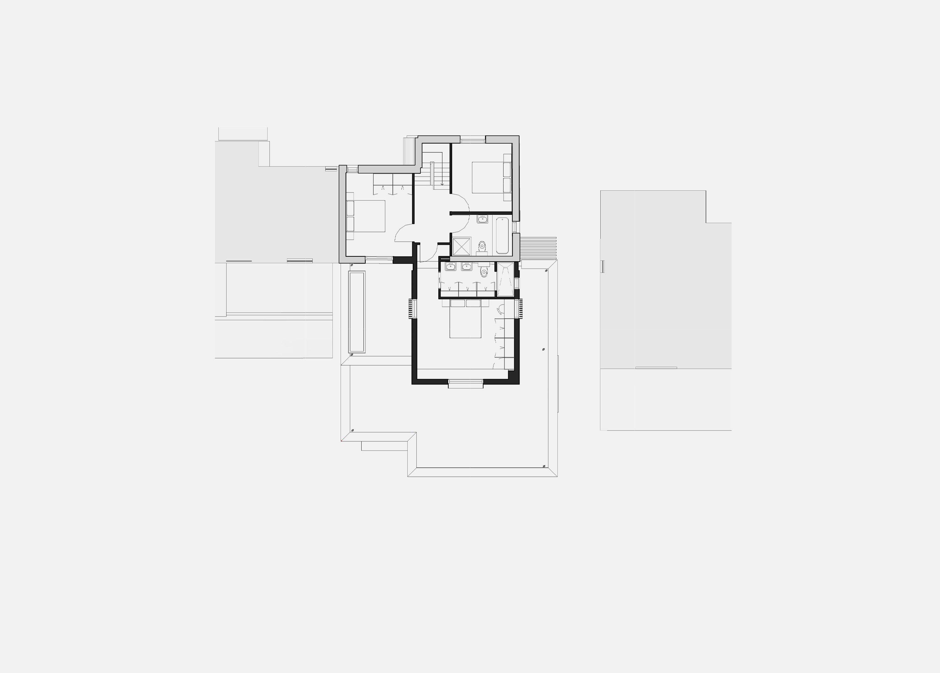 First floor plan of the Hills Avenue house, Cambridge, showing bedrooms within the retained roof and the new gabled volume behind, with the sedum roof of the extension below.