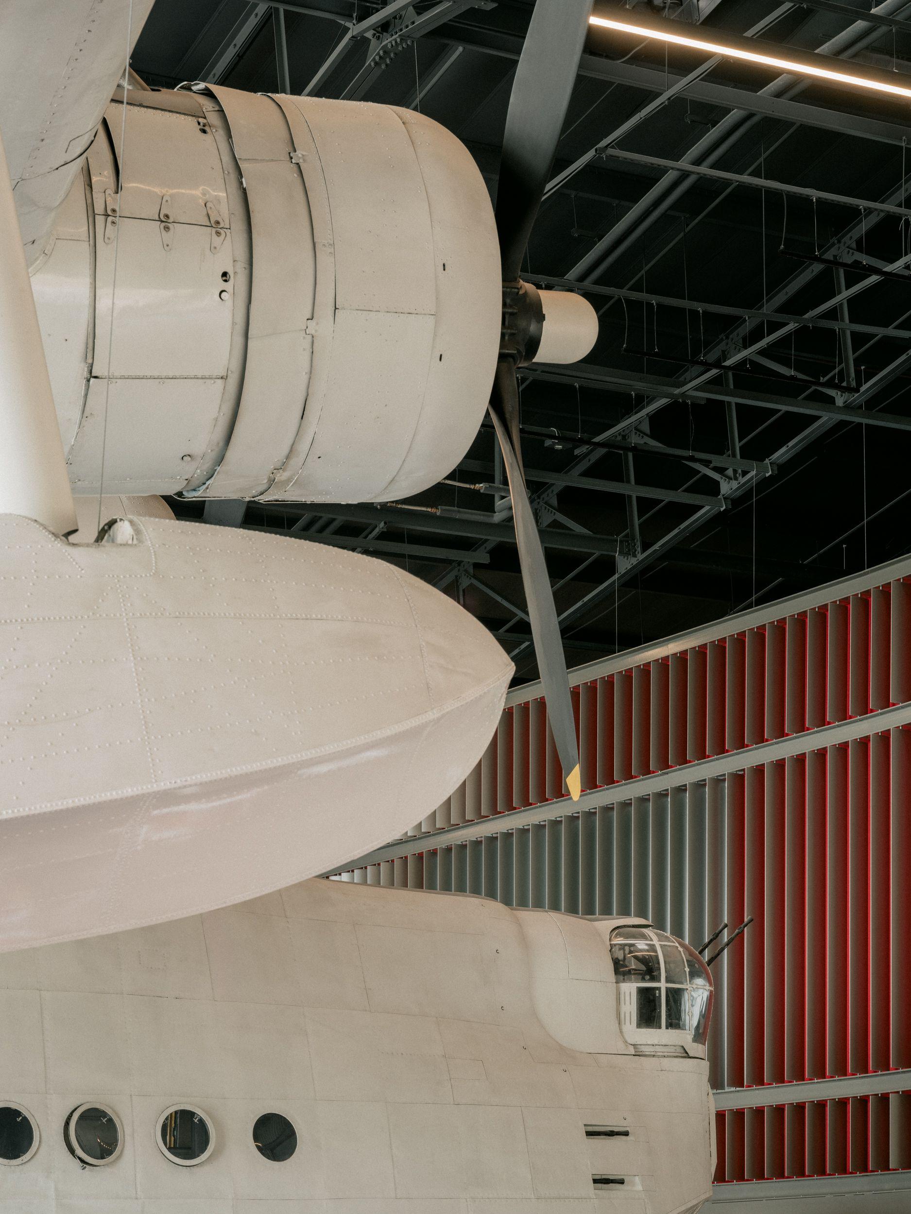 Sunderland airframe set against the pavilion's red-framed fin screen at the RAF Museum, London