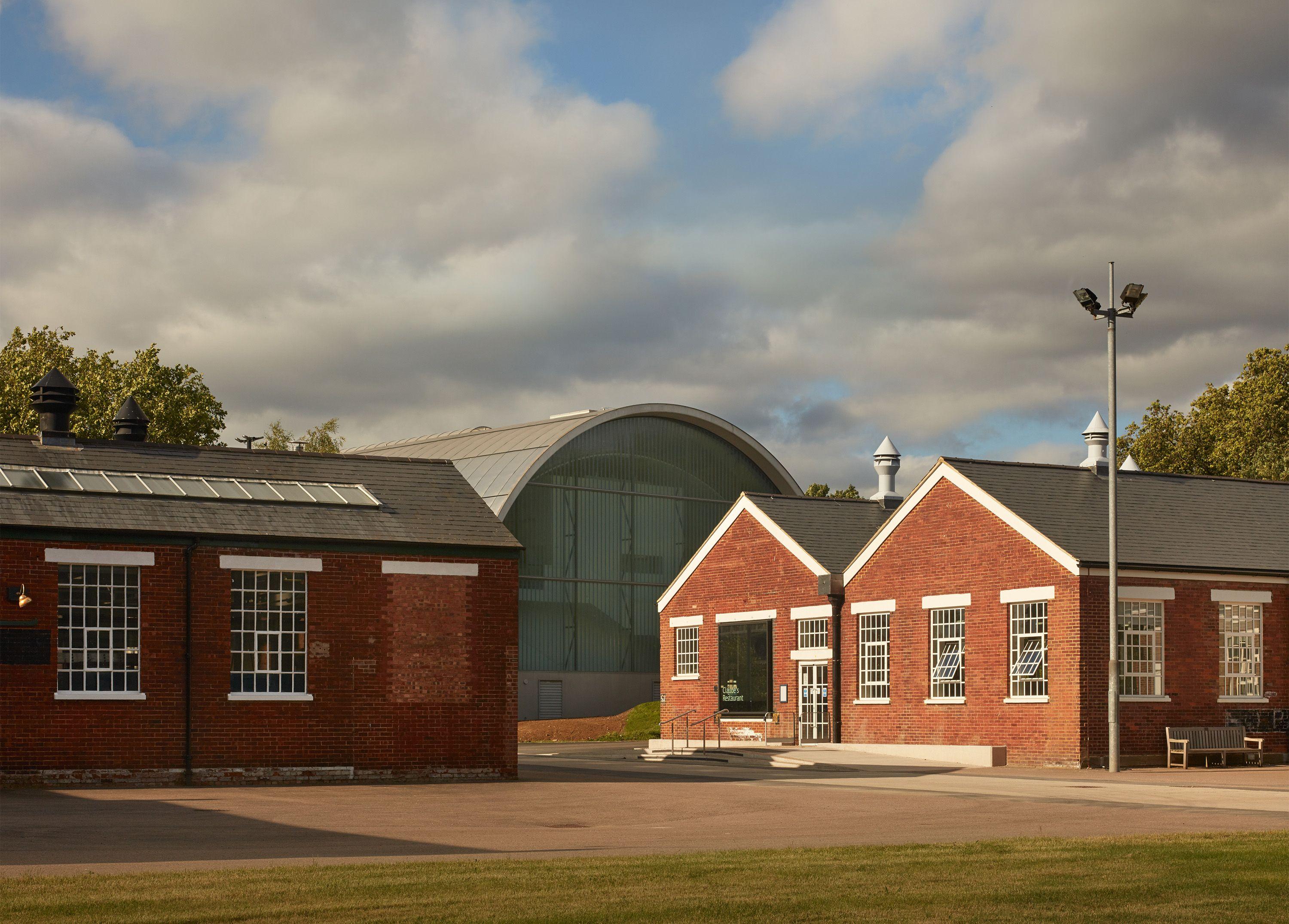 The restored 1930s supplies building at the RAF Museum, London, its steel trusses and rooflights above the 170-seat restaurant