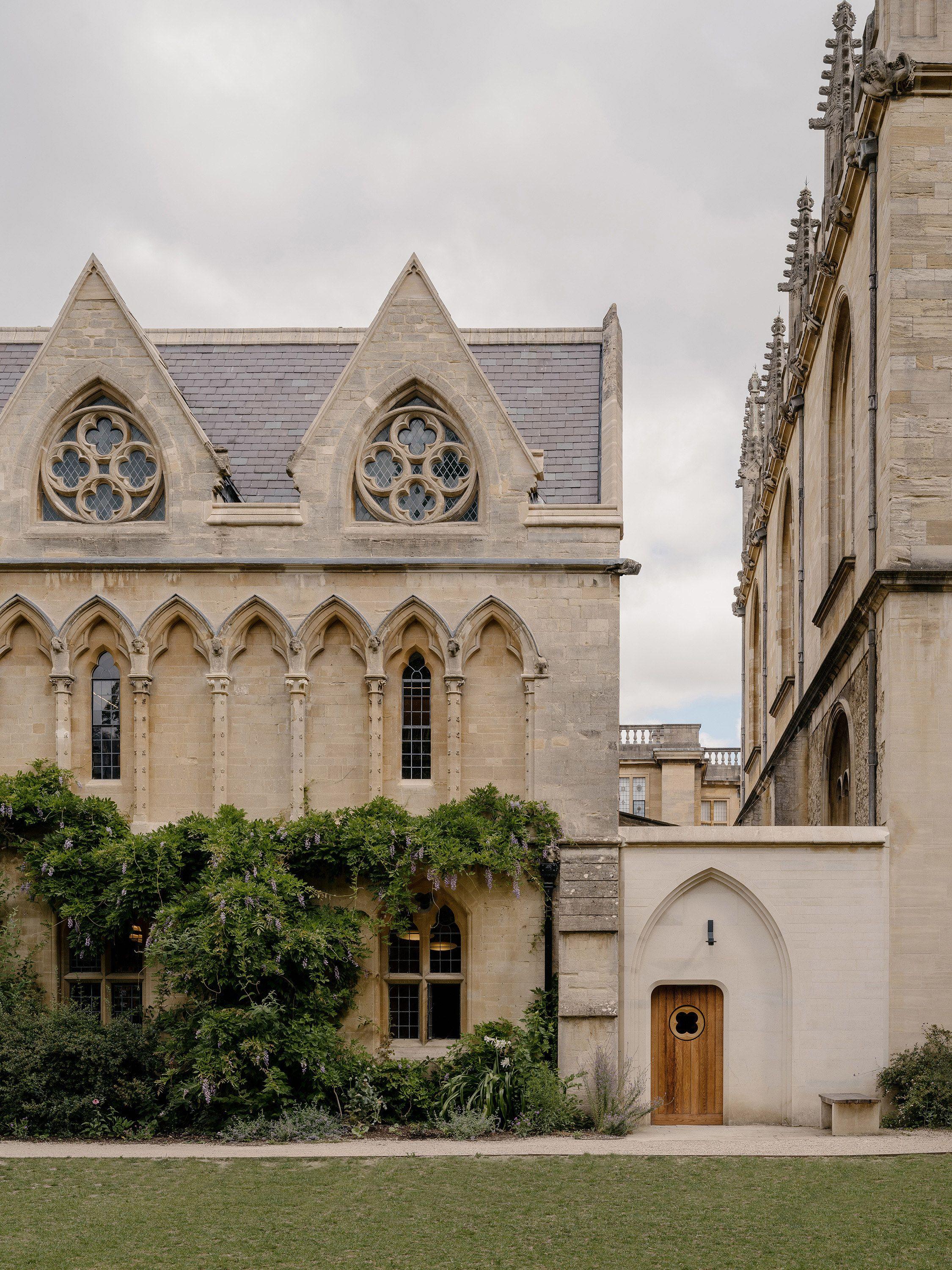 The new library entrance at Exeter College, Oxford, its Clipsham stone arch and oak door set into the narrow gap between the library and the Convocation House wall.
