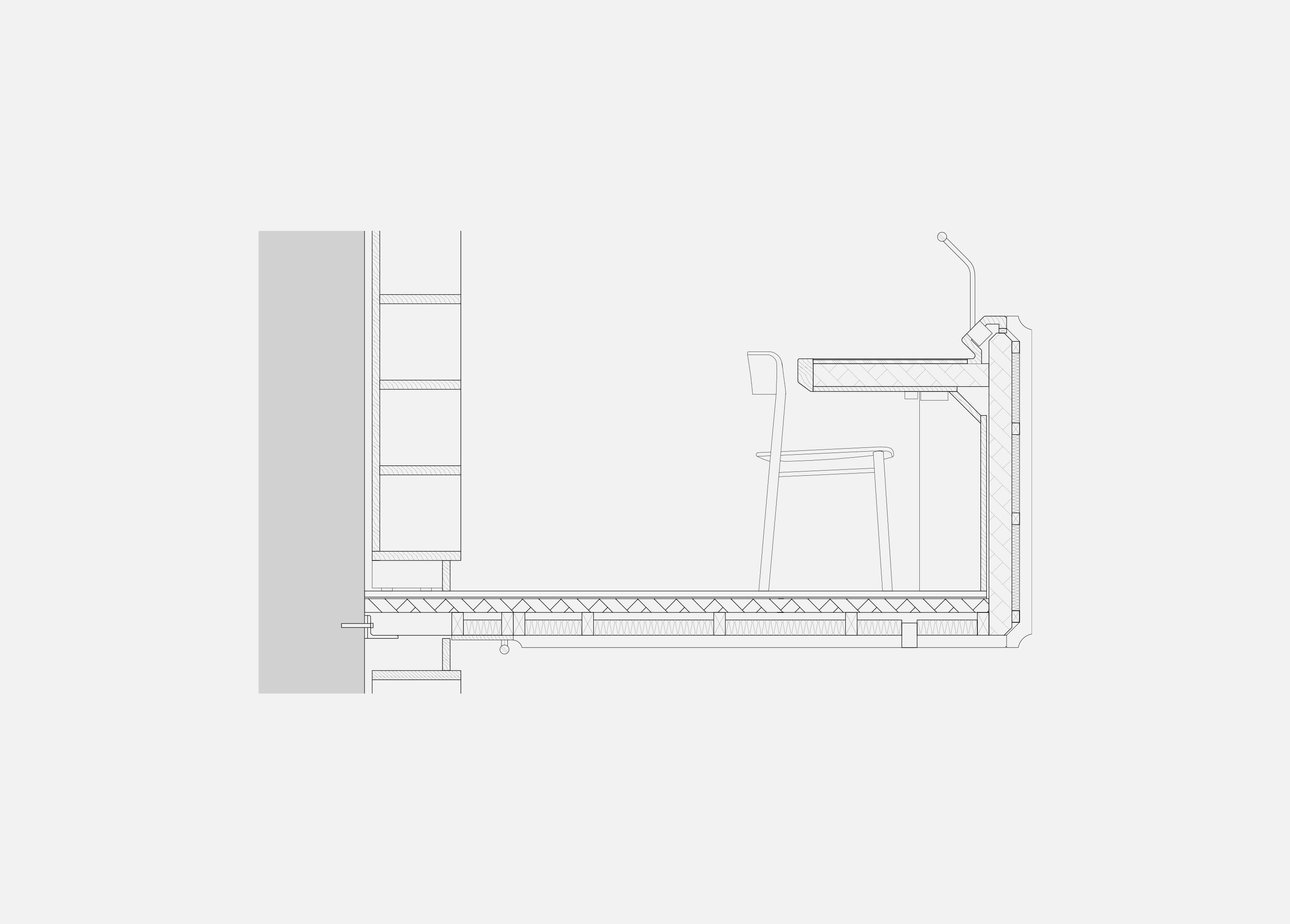 Detail section through a new oak study desk at Exeter College Library, Oxford, showing the integrated task light, under-desk book storage and the shelving set against the wall behind.