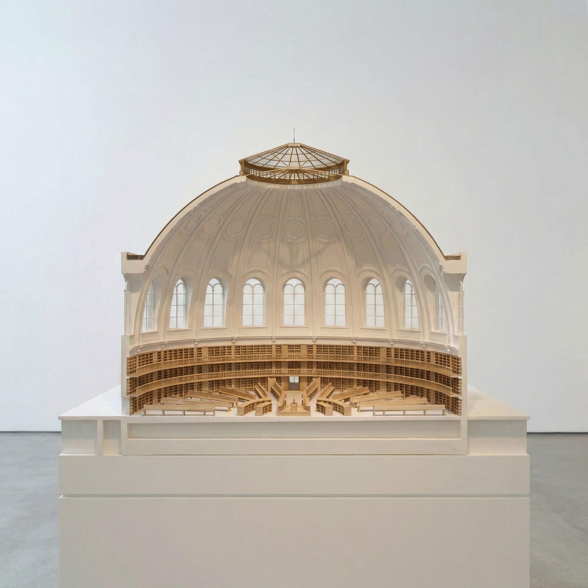 Sectional model of the British Museum's Round Reading Room, cut away to show the domed roof, lantern and ring of arched windows above the tiered shelving and radiating desks within.